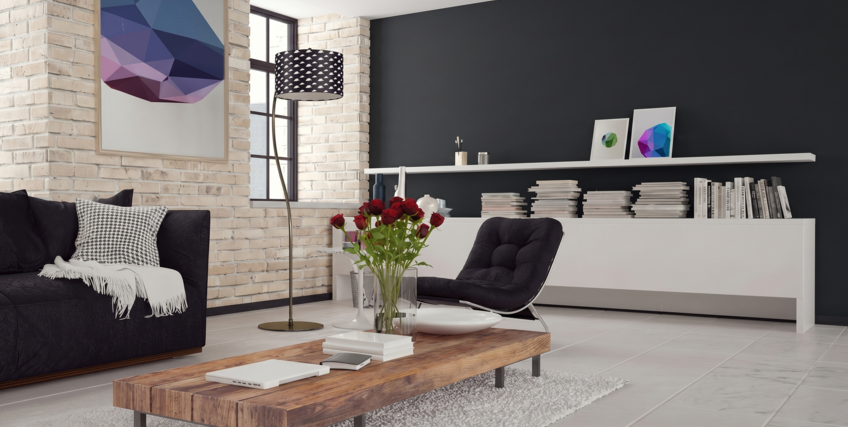 Nowoczesny salon z ciemno szarą ścianą i ceglaną ścianą